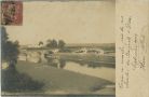 Photo ancienne - Dax - Carte photo - Passage d'un train sur le pont du chemin de fer (vue prise d'une chambre des Baignots)